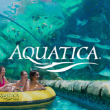 The Aquatica logo with a family in a raft floating through an arching aquarium