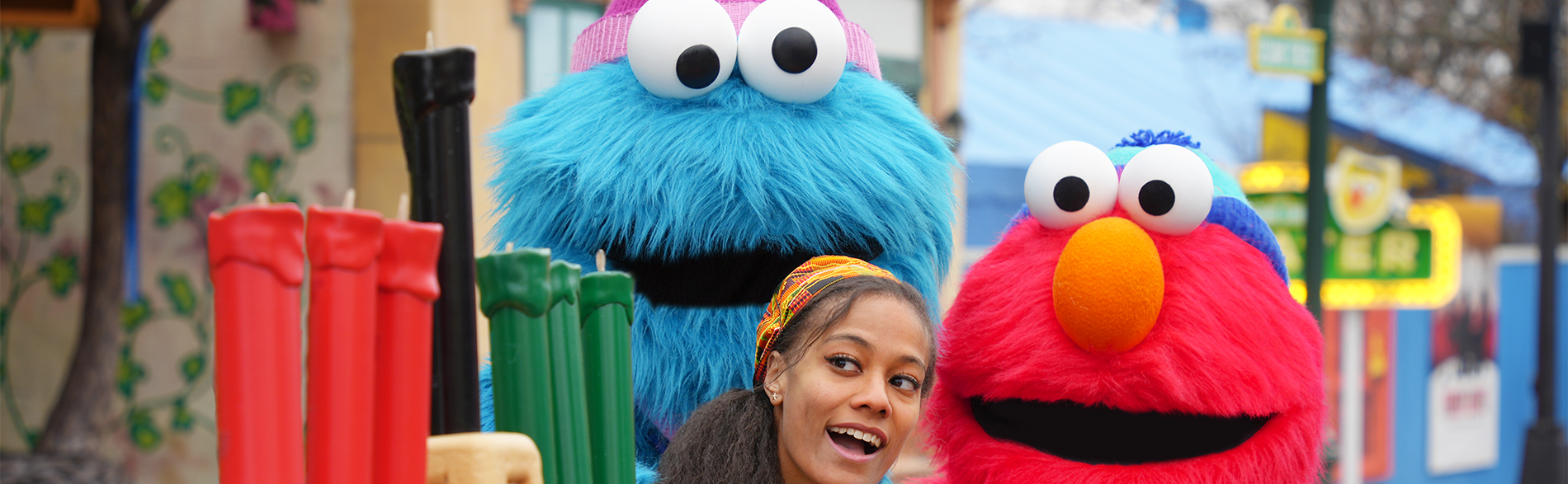Girl with Cookie Monster and Elmo