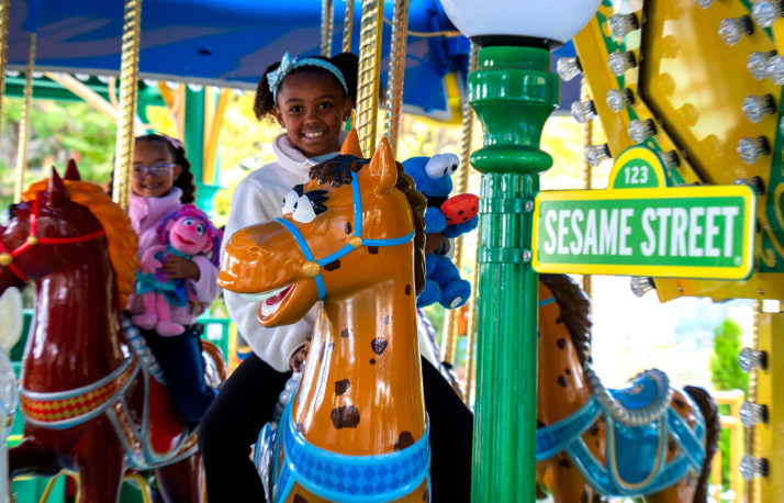 Two girls on carousel