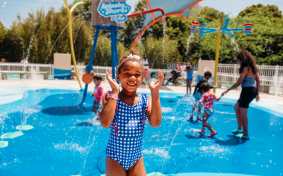 Little girl playing in splash pad at SPL.