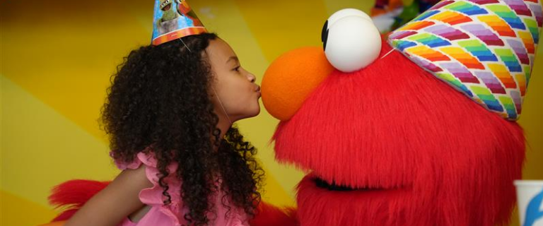 Girl with Elmo