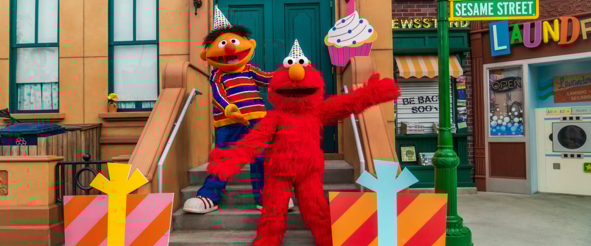 Elmo and Ernie Sesame Street characters in Birthday hats