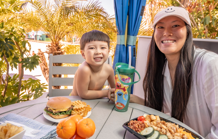 Mom and son with food at cabanas.