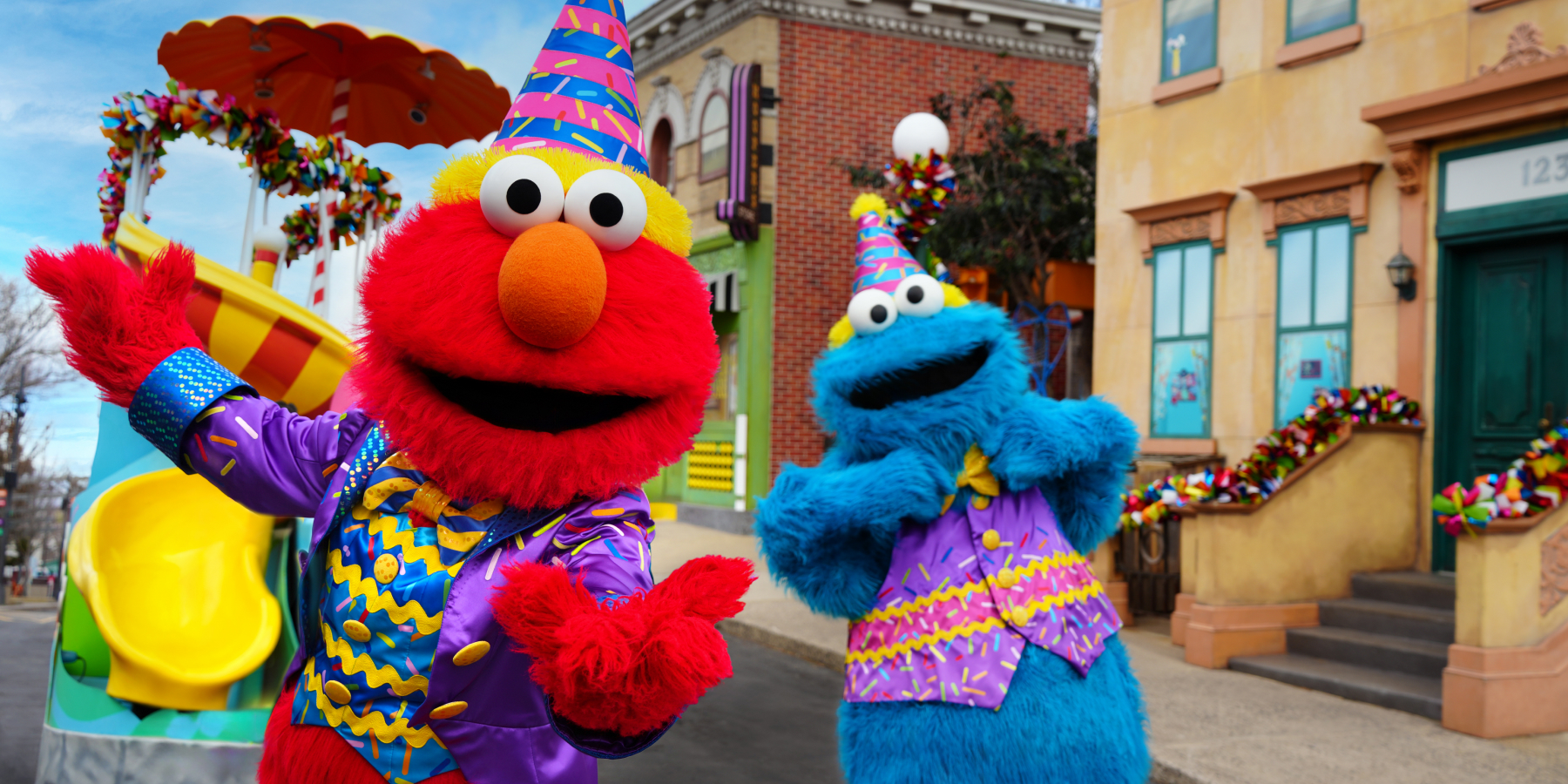 Elmo and Cookie Monster in birthday attire