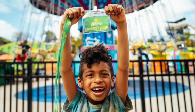 Little boy hold a pass up.